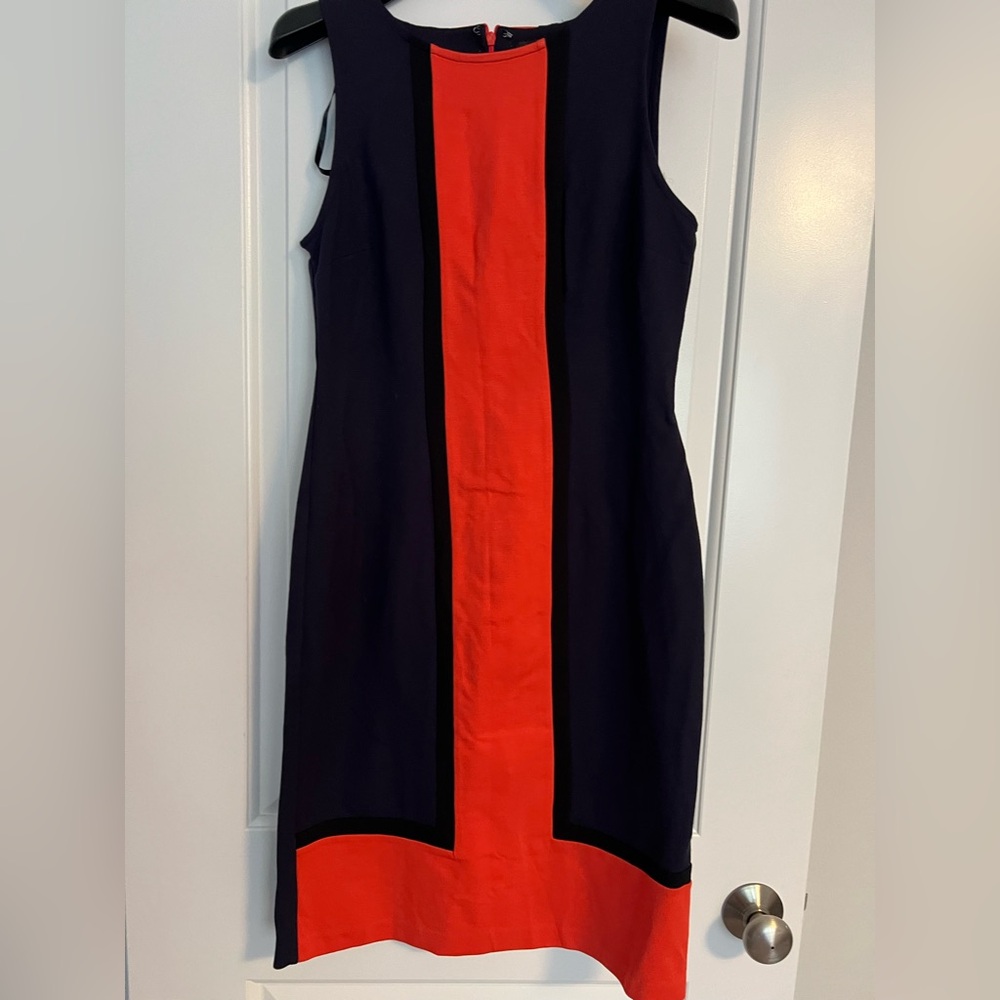 Color block knit dress in navy, orange and black.